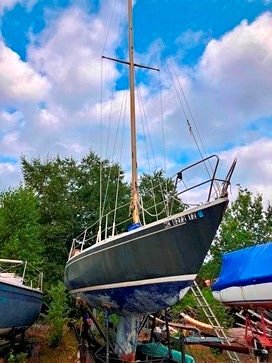 The 1973 Albin Ballad currently under evaluation, sitting on a cradle in a boatyard